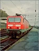 BR 143/697546/die-db-143-267-3-steht-mit Die DB 143 267-3 steht mit einem Nahverkehrszug in Koblenz. 

13. Mai 1998