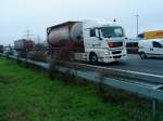 SZM MAN TGX 18.440 mit Tankkontainer-Auflieger gesehen auf der A 61 bei der Raststtte Dannstadt am 14.01.2014