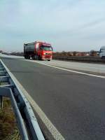 SZM Volvo FH mit Container-Pritsche beladen mit einem Tankcontainer gesehen auf der A 6 Hhe Grnstadt am 18.02.2014