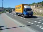 LKW MAN Motorwagen mit Pritschen-Planen Aufbau der Spedition Dachser unterwegs in Bad Drkheim am 16.08.2013