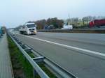 MAN TGA Gliederzug mit Pritschenaufbau unterwegs auf der A 61 bei Dannstadt am 19.11.2013