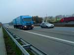 LKW MAN Gliederzug mit Pritsche-Planen-Aufbau unterwegs auf der A61 bei Dannstadt am 19.11.2013