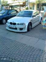 PKW BMW 3er-Serie mit Tuning-Anbau gesehen auf dem Stadtplatz in Bad Drkheim am 16.05.2014