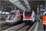 tgv-lyria/693685/tgv-lyria-und-rabe-522-201 TGV Lyria und RABe 522 201 in Lausanne.

27 Feb. 2020