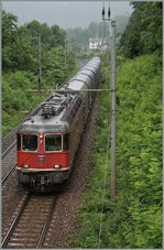 re-4-4-ii/514345/eine-re-44-ii-mit-einem Eine Re 4/4 II mit einem Güterzug bei Varzo. 
2. Juli 2014 
