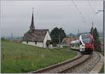 tpf-transport-publics-fribourgoise/698550/der-tpf-rabe-527-193-als Der TPF RABe 527 193 als RE von Bulle nach Fribourg bei der 'Chappel de Vaulruz' unter der herrlichen 'windschiefen' Fahrleitung. 

12. Mai 2020 
