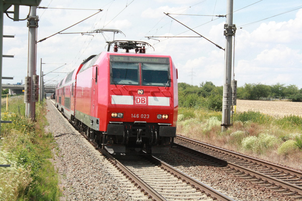 146 023 mit dem RE30 mit ziel Magdeburg Hbf bei der einfahrt in Zberitz am 14.7.20