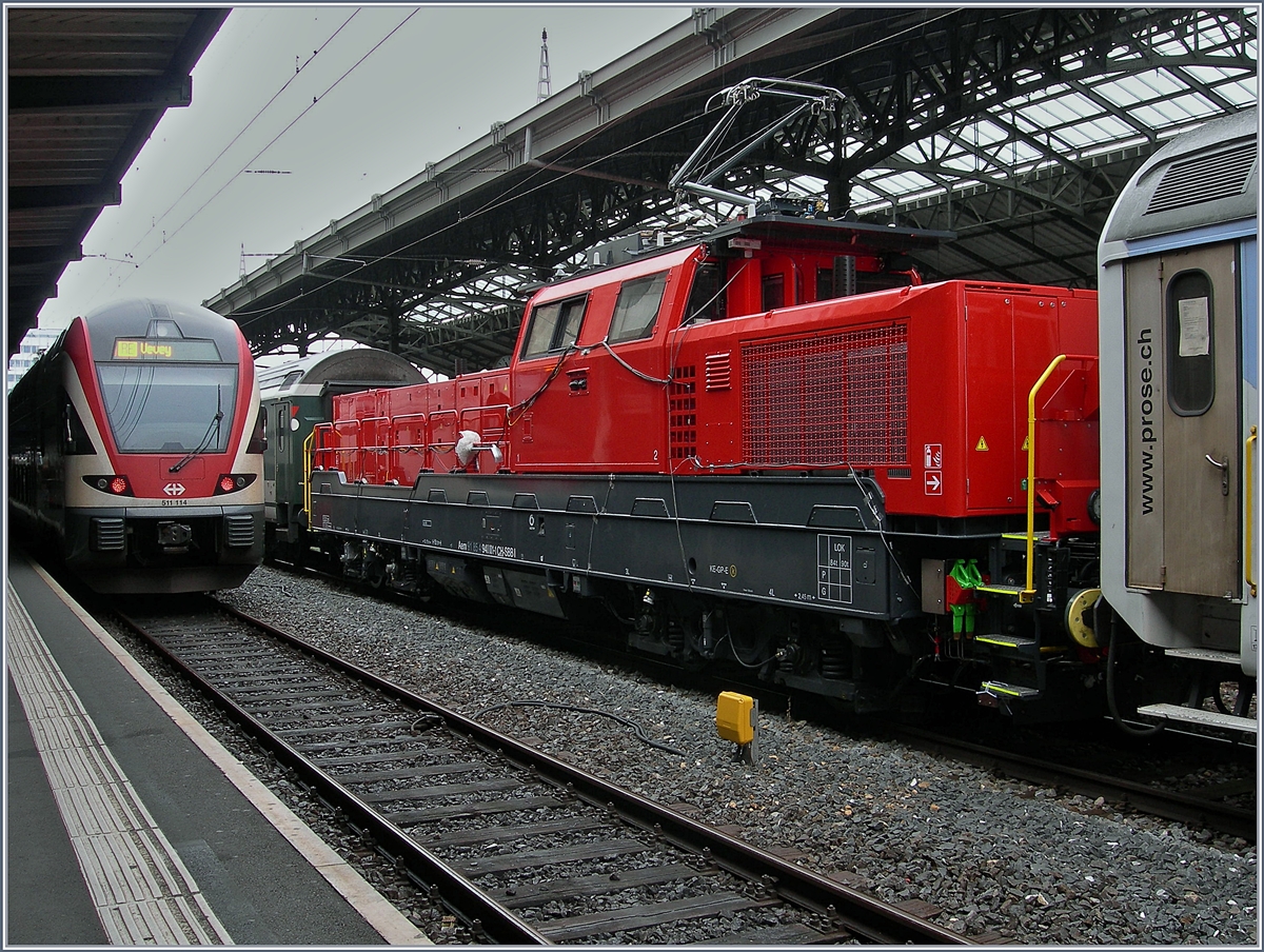 Aem 940 Testfahrten: Da die neue Aem  940 001-1 (UIC 9185 4 940 001-1 CH-SBBI) zwischen den Wagen eingereiht war, konnte sie nur eingeschränkt fotografiert werden.
Lausanne, den 16. Mai 2018