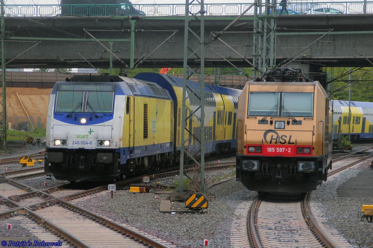 BTH/START 246 004 mit RE5 nach Cuxhaven und die abgestellte BRLL/HSL 185 597 am 08.05.2019 in Hamburg-Harburg