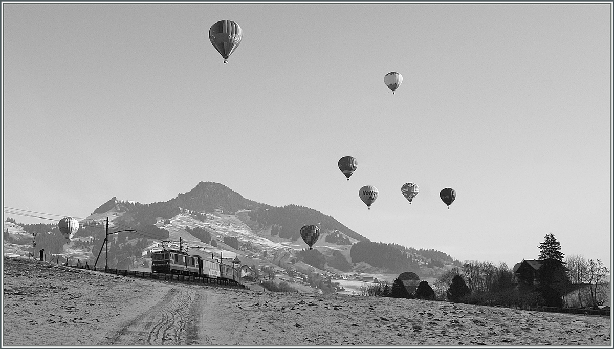 Ein MOB GDe 4/4 (Serie 6000) ist währnd des Ballons Festivals bei Château d'Oex auf dem Weg nach Montreux. 

23. Jan. 2011
