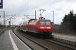 146 023 verlsst mit dem RE30 mit ziel Halle/Saale Hbf beim verlssen dess Bahnhofs Zberitz am 19.3.21
