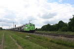 151 138 von HSL mit einem Autotransportzug bei der Vorbeifahrt an Braschwitz am 5.7.21