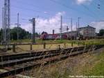 OHE 270081 mit einem Holzzug mit Ziel Stendal beim Durchfahren des Bahnhofs Rostock Hbf am 22.6.13