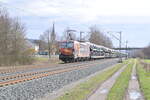 TXL 193 878   Wir brennen fr was wir tun  mit einem Autozug am Haken gen Karlstadt fahrend In Thngersheim.