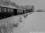 Am 20.3.13 ist RBB Mh 53 unterwegs nach Putbus mit einem Schneemann im Bild oder auch weier Eisenbahner genannt. / hier bei Beuchow
