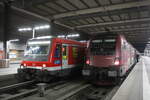 628 567 / 928 567 der Südostbayernbahn mit Ziel Mühldorf (Oberbayern) und 1116 227 der ÖBB im Bahnhof München Hbf am 24.3.21