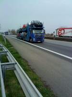 LKW Volvo FH Autotransporter beladen mit fabrikneuen Audi gesehen auf der A 61 Hhe Rasthof Dannstadt am 18.03.2014
