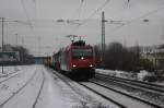 482 034-6 von der SBB Cargo bei der Durchfahrt mit einem Containerzug in Bonn-Beuel am 29.12.2010.