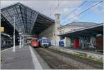 Der FS Treniatalia ETR 400 031 von Paris Gare de Lyon und der SNCF B 82574 stehen unter der mächtigen Bahnhofshalle von Lyon Perrache.