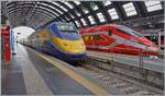 Vor dem FS Trenitalia ETR 400 010 im Hintergrund steht in Milano Centrle der  RFI ETR 500 Diamante 2.0 mit Triebkopf 93 83 2404 648-2 I-RIF. 

30. Sept. 2026