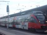4024 021 als R 3010 nach Salzburg Taxham Europark am 08.09.2013 beim Halt in Attnang-Puchheim.