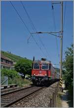Die SBB Cargo Re 6/6 11646 (Re 620 064-6) 'Bussigny' ist bei Ligerz mit einem Güterzug in Richtung Neuchâtel unterwegs. 

19. Juni 2025