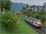 Der SBB RABe 511 110 ist als RE nach St-Maurice bei La Tour de Peilz unterwegs. 

21. Juni 2024