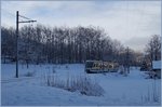 Winter bei Gagnone-Orcesco: Ein SSIF Ferrovia Vigezzina Regionalzug auf dem Weg nach Re.