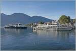 Während das Motoschiff  MILANO  im bei der Schiffanlegestelle von Locarno steht, nähert sich im Hintergrund ein weiteres Ausflugsschiff der Navigazione Lago Maggiore (NLM).