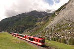 Der Bergsturz von Randa: Triebwagen ABDeh4/10 2013 auf der Fahrt nach Randa und Zermatt hat den Scheitelpunkt der Umfahrungsstrecke fast erreicht.